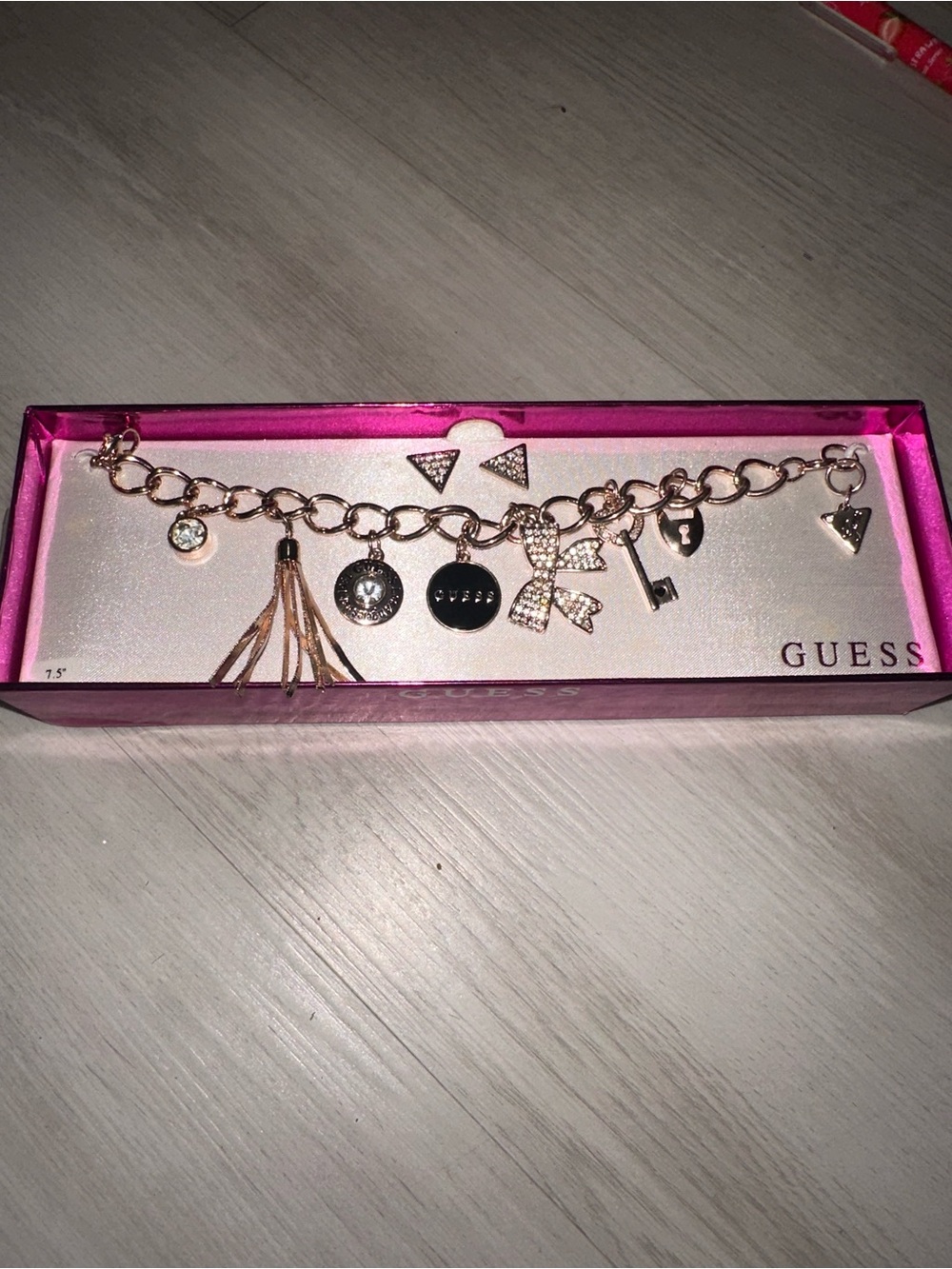 GUESS Rose Gold Charm Link Bracelet with Bow & Tassel Charms